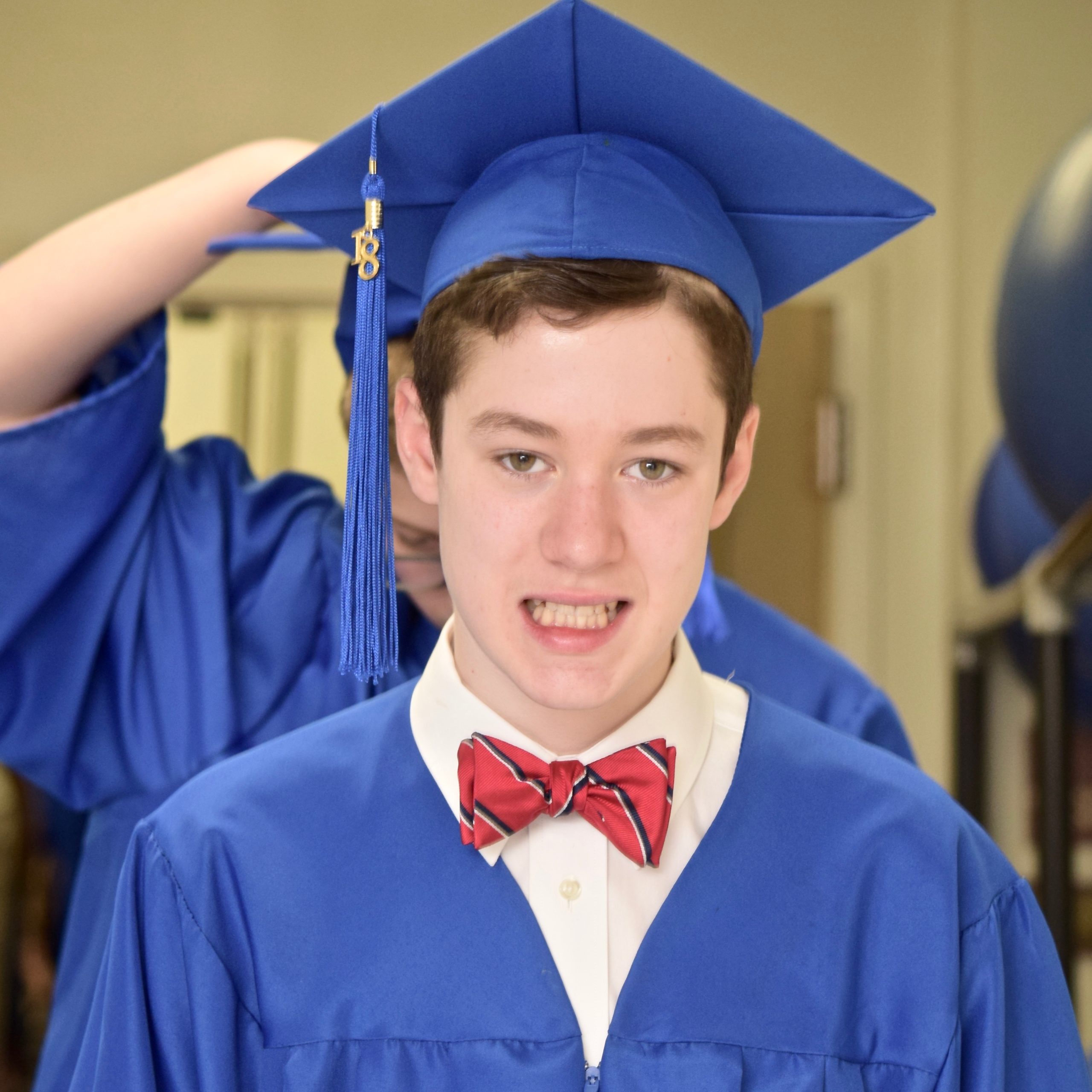 Middle School student in cap and gown